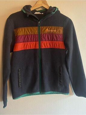 cotopaxi navy fleece jacket with gold, plum and orange panels